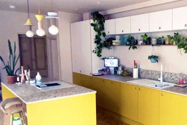 plywood kitchen with an island in yellow and pale pink laminate