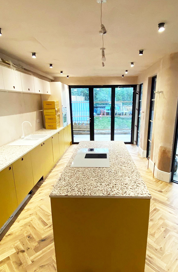 plywood and laminate doors being installed on a new kitchen