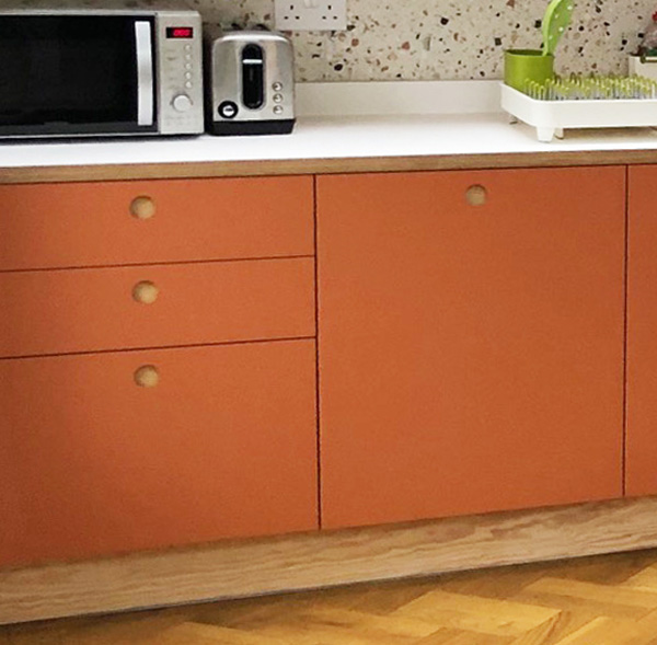 kitchen drawers and doors in terracotta laminate and plywood